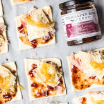 Pastry squares with ham, cheese and Hot Pepper Berry Bacon Jam before baking