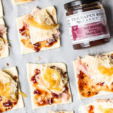 Pastry squares with ham, cheese and Hot Pepper Berry Bacon Jam before baking