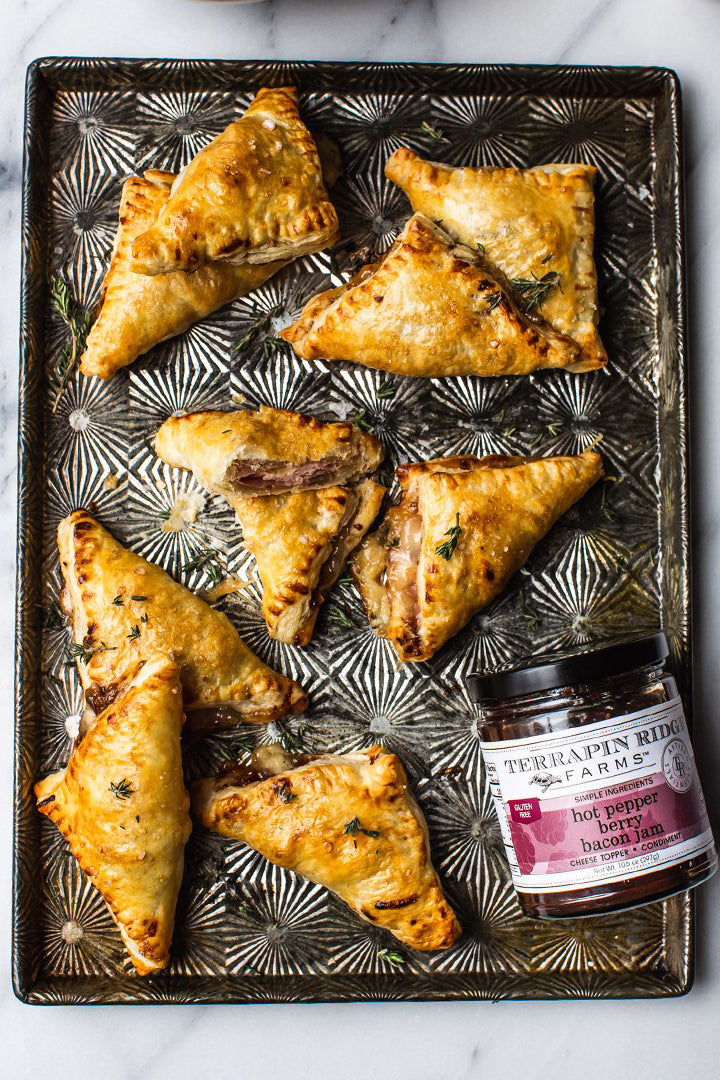 Golden baked pastry triangles filled with Hot Pepper Berry Bacon Jam