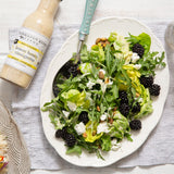 Leafy green salad with blackberries, cheese and nuts with Lemon Honey Vinaigrette