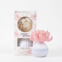 Bridgewater Sweet Grace Flower Diffuser with pink petals in a white rounded vase, shown beside its Sweet Grace gift box