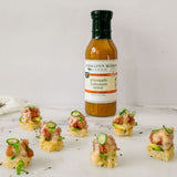 Appetizers topped with sliced jalapeños and Pineapple & Habanero Sauce