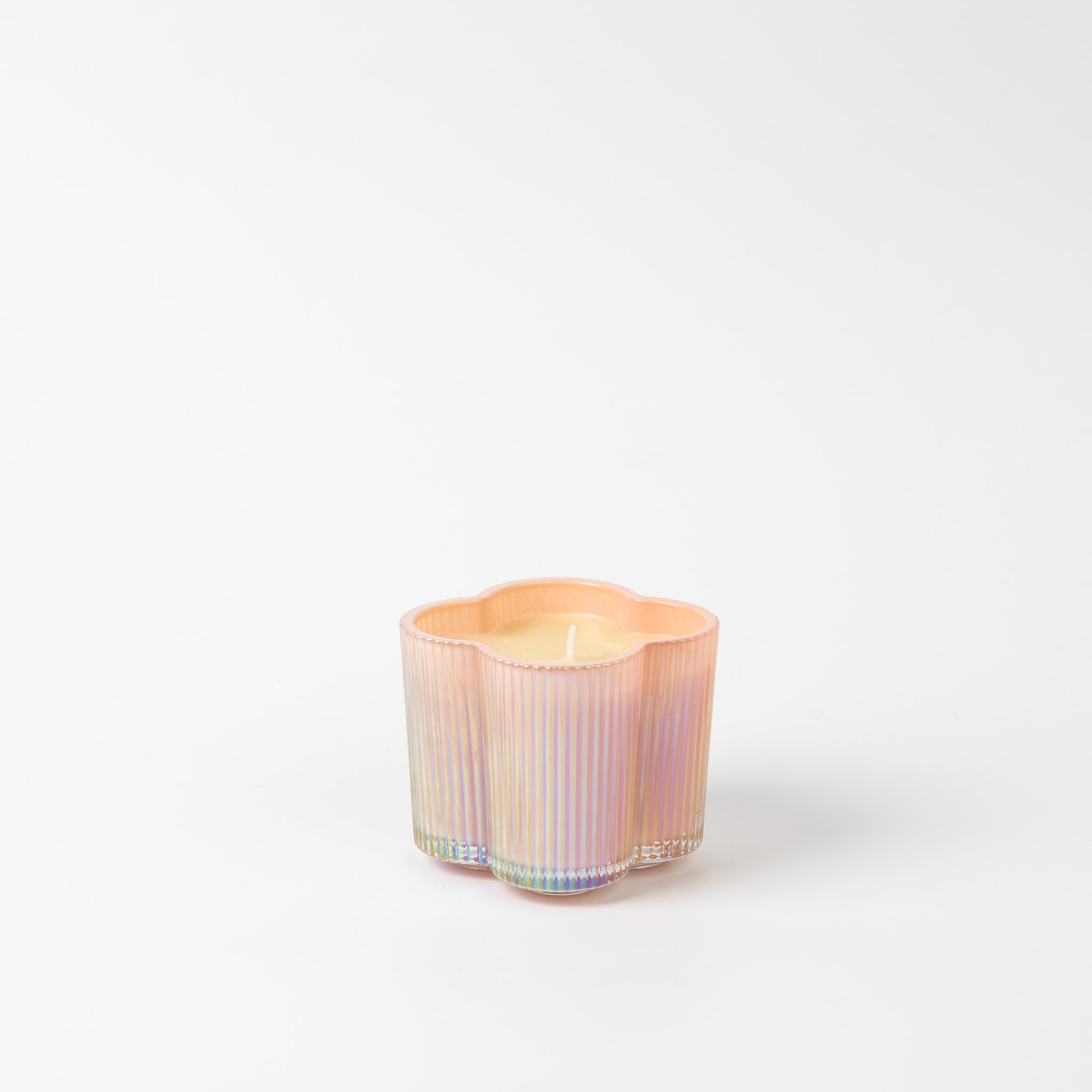 Bridgewater Sweet Grace candle in a pastel iridescent flower-shaped glass vessel with scalloped edges, on a white background