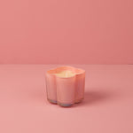 Bridgewater Sweet Grace iridescent flower candle lit, glowing softly