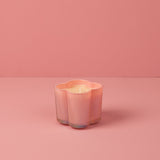 Bridgewater Sweet Grace iridescent flower candle lit, glowing softly