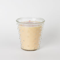 Bridgewater Sweet Grace candle in a clear hobnail glass jar with raised dots, on a white background